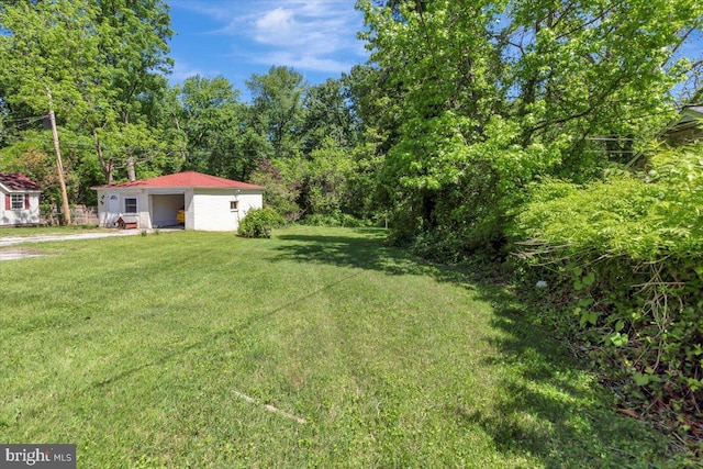3404 Chesley Ave, Baltimore, MD 21234 - view of green lawn featuring a detached garage