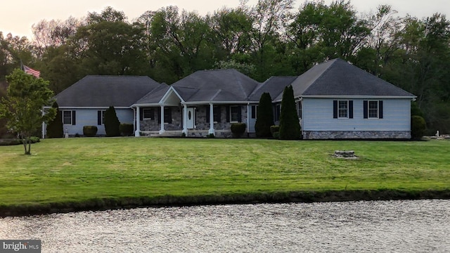 1081 Caldwell Corner Rd, Townsend, DE 19734 - view of front of home with covered porch, a water view, and a front lawn