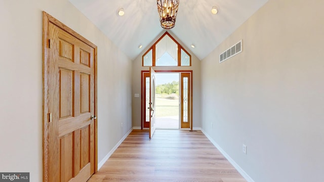 1081 Caldwell Corner Rd, Townsend, DE 19734 - foyer entrance featuring visible vents, lofted ceiling, baseboards, light wood-style floors, and a notable chandelier