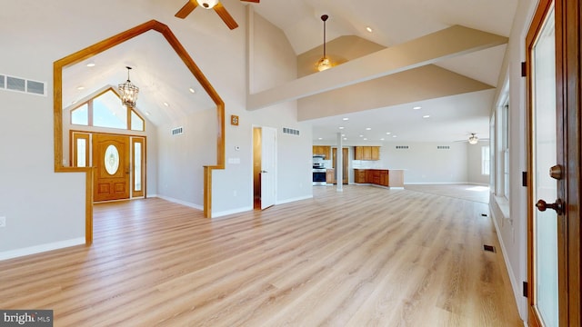 1081 Caldwell Corner Rd, Townsend, DE 19734 - entrance foyer featuring visible vents, light wood finished floors, and ceiling fan with notable chandelier
