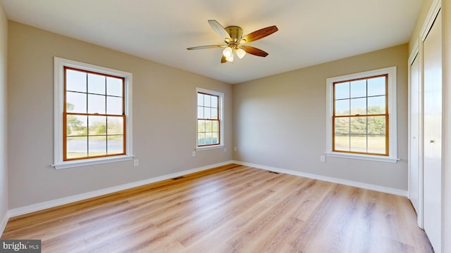 1081 Caldwell Corner Rd, Townsend, DE 19734 - unfurnished room featuring baseboards, light wood finished floors, ceiling fan, and visible vents