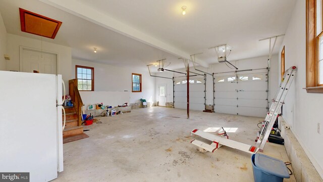 1081 Caldwell Corner Rd, Townsend, DE 19734 - garage with freestanding refrigerator and a garage door opener