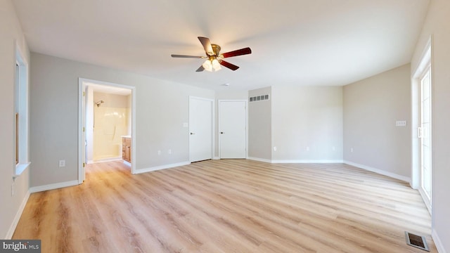 1081 Caldwell Corner Rd, Townsend, DE 19734 - unfurnished bedroom featuring visible vents, connected bathroom, light wood finished floors, and baseboards