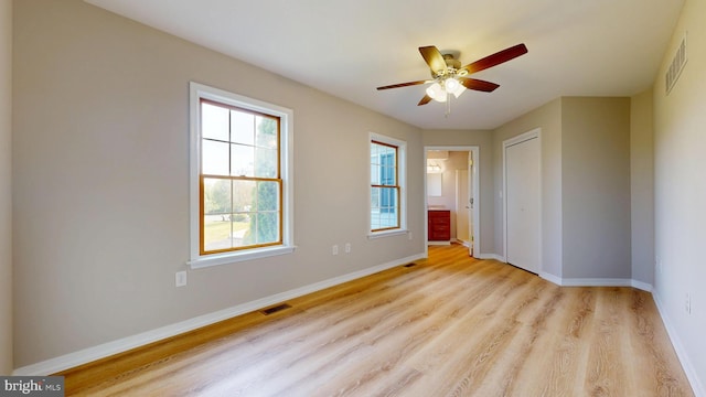 1081 Caldwell Corner Rd, Townsend, DE 19734 - unfurnished bedroom featuring a closet, baseboards, visible vents, and light wood-style floors