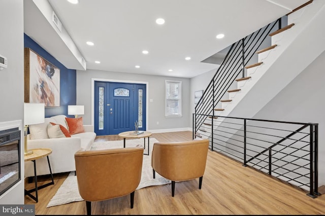 interior space featuring recessed lighting, wood finished floors, visible vents, and baseboards