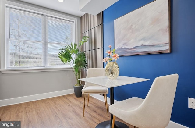 dining area with wood finished floors and baseboards