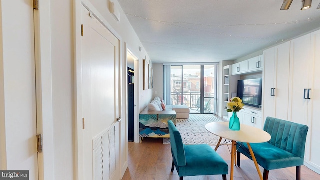 50 Florida Ave NE Unit 412, Washington, DC 20002 - interior space featuring expansive windows, visible vents, and light wood-style flooring