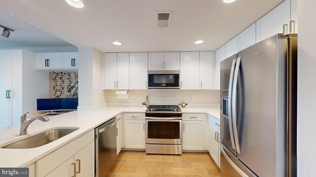 50 Florida Ave NE Unit 412, Washington, DC 20002 - kitchen with appliances with stainless steel finishes, a sink, visible vents, and recessed lighting