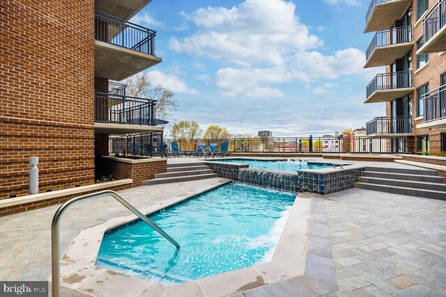 50 Florida Ave NE Unit 412, Washington, DC 20002 - pool featuring a community hot tub, a patio area, and fence