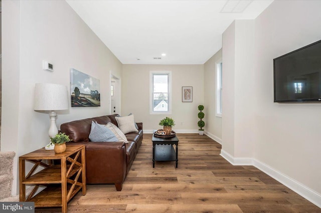 713 3rd St, Martinsburg, WV 25404 - living area with wood finished floors, baseboards, and recessed lighting