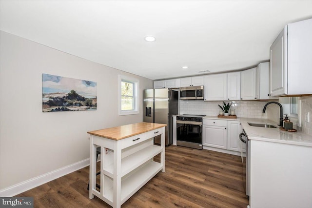 713 3rd St, Martinsburg, WV 25404 - kitchen featuring open shelves, a sink, dark wood-style floors, stainless steel appliances, and backsplash