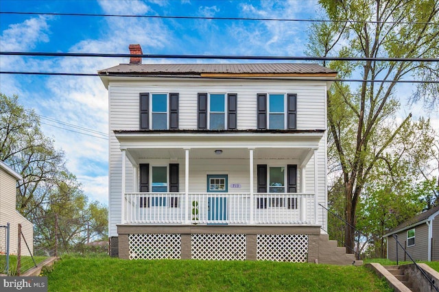 713 3rd St, Martinsburg, WV 25404 - view of front of property featuring a front yard, metal roof, covered porch, and a chimney