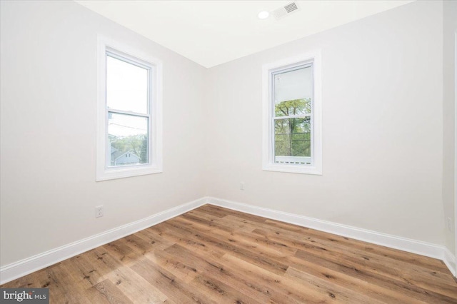 713 3rd St, Martinsburg, WV 25404 - unfurnished room with wood finished floors, baseboards, and visible vents