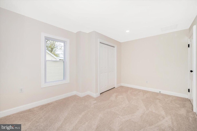 713 3rd St, Martinsburg, WV 25404 - unfurnished bedroom featuring a closet, baseboards, recessed lighting, and light carpet