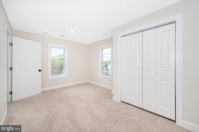 713 3rd St, Martinsburg, WV 25404 - unfurnished bedroom with a closet, visible vents, baseboards, and carpet