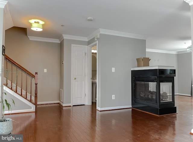 920 Pine Forest Ln Unit 1812, Upper Marlboro, MD 20774 - unfurnished living room with wood-type flooring, ornamental molding, a multi sided fireplace, and baseboards