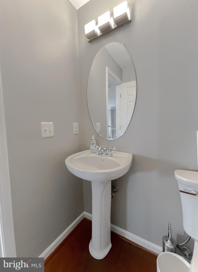 920 Pine Forest Ln Unit 1812, Upper Marlboro, MD 20774 - half bathroom with toilet, baseboards, and wood finished floors