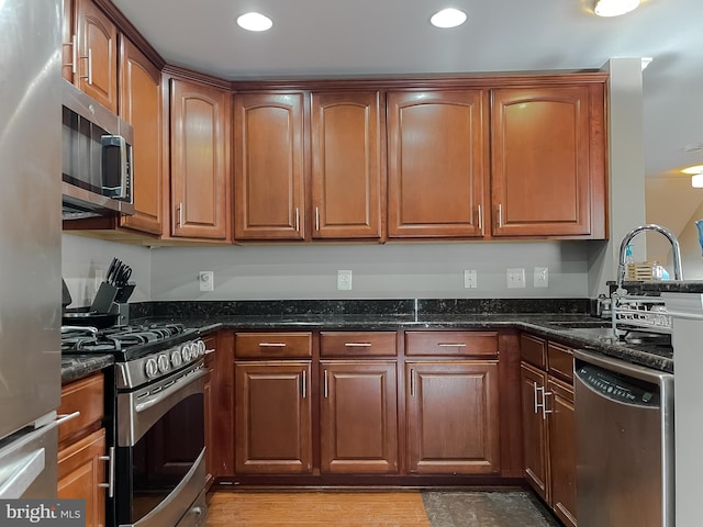 920 Pine Forest Ln Unit 1812, Upper Marlboro, MD 20774 - kitchen featuring recessed lighting, brown cabinetry, dark stone countertops, and stainless steel appliances