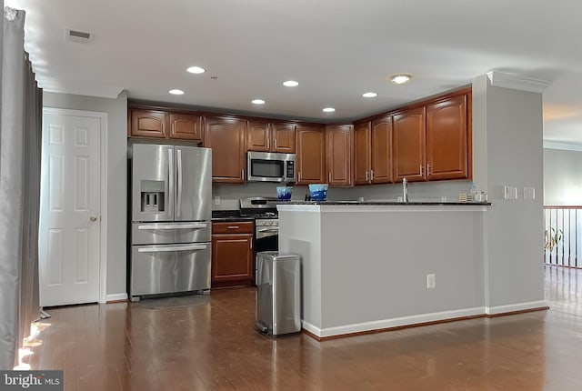 920 Pine Forest Ln Unit 1812, Upper Marlboro, MD 20774 - kitchen featuring visible vents, ornamental molding, dark wood-style flooring, dark countertops, and appliances with stainless steel finishes