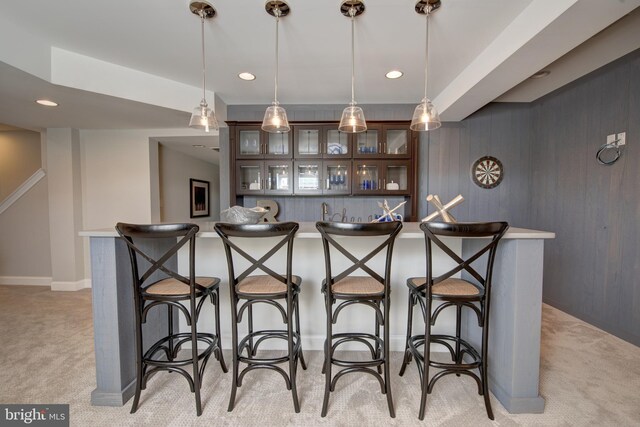 126 Green Forest Dr Unit 5Houston, Middletown, DE 19709 - bar featuring light colored carpet, baseboards, decorative light fixtures, and indoor wet bar