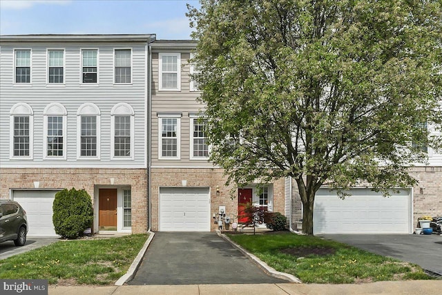 view of property featuring aphalt driveway
