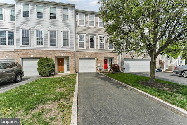 view of property with driveway and an attached garage