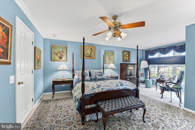 carpeted bedroom with baseboards, ornamental molding, and a ceiling fan