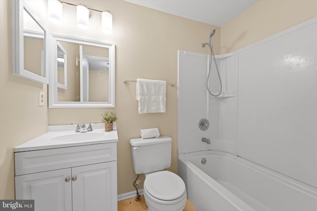 full bath featuring toilet, shower / bathtub combination, and vanity