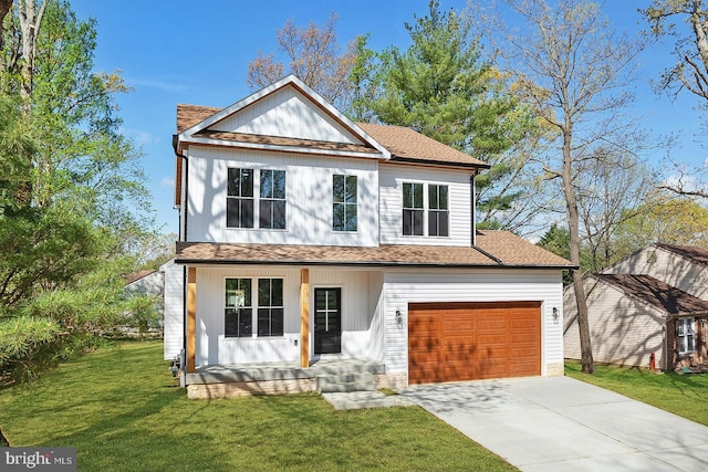 view of front of home with a porch, a shingled roof, a front yard, and concrete driveway