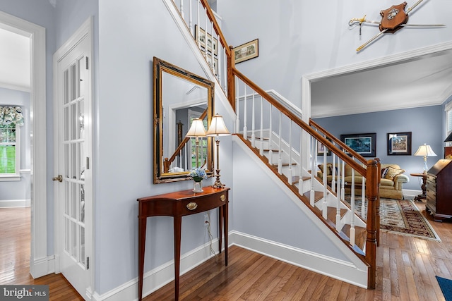 26 Blossom Wood Ct, Stafford, VA 22554 - staircase with crown molding, baseboards, and hardwood / wood-style flooring