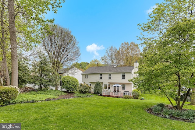 26 Blossom Wood Ct, Stafford, VA 22554 - back of property with a wooden deck, a lawn, and a chimney
