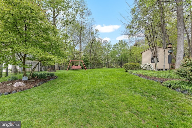 26 Blossom Wood Ct, Stafford, VA 22554 - view of yard with an outbuilding, a shed, fence, and a playground