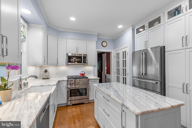 26 Blossom Wood Ct, Stafford, VA 22554 - kitchen featuring white cabinetry, recessed lighting, a sink, stainless steel appliances, and decorative backsplash