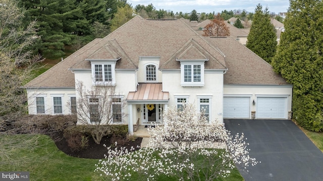 106 Mahogany Way, Upper Gwynedd, PA 19446 - french provincial home featuring driveway, stone siding, a garage, a shingled roof, and stucco siding