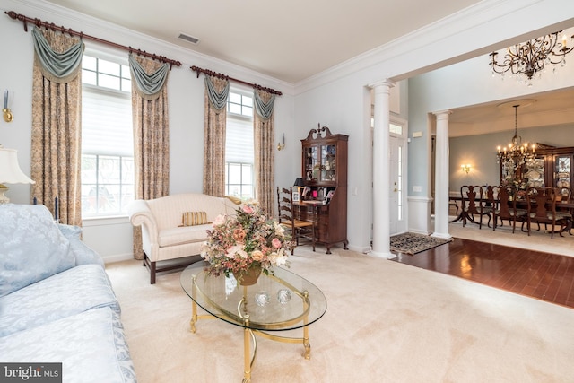 106 Mahogany Way, Upper Gwynedd, PA 19446 - living area with visible vents, carpet flooring, ornate columns, and a notable chandelier