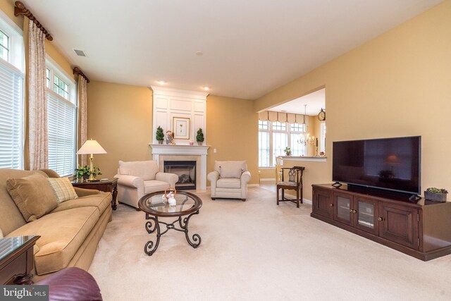 106 Mahogany Way, Upper Gwynedd, PA 19446 - carpeted living room featuring baseboards, visible vents, and a fireplace