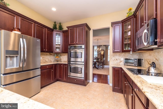 106 Mahogany Way, Upper Gwynedd, PA 19446 - kitchen with recessed lighting, a toaster, light tile patterned flooring, decorative backsplash, and appliances with stainless steel finishes