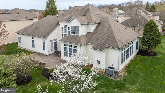 106 Mahogany Way, Upper Gwynedd, PA 19446 - rear view of property with roof with shingles, central air condition unit, a patio area, a lawn, and stucco siding