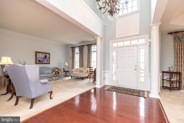 106 Mahogany Way, Upper Gwynedd, PA 19446 - entryway featuring ornamental molding, plenty of natural light, wood finished floors, and ornate columns