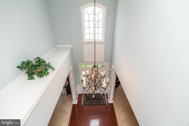 106 Mahogany Way, Upper Gwynedd, PA 19446 - entryway featuring plenty of natural light, a towering ceiling, an inviting chandelier, and dark wood-style flooring