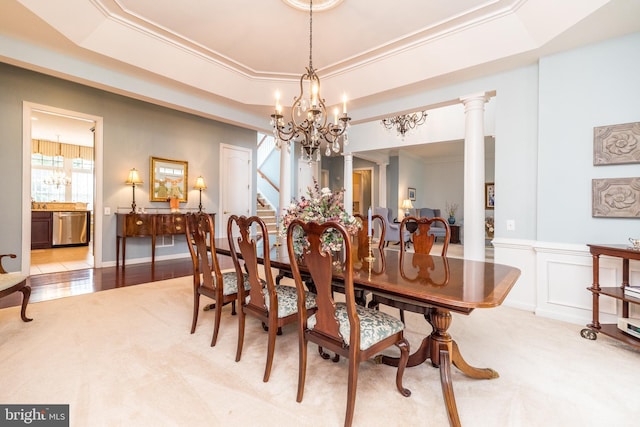 106 Mahogany Way, Upper Gwynedd, PA 19446 - dining area with a tray ceiling, wainscoting, a notable chandelier, stairs, and ornamental molding