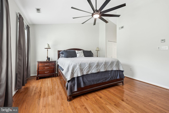 bedroom featuring visible vents, baseboards, a closet, and light wood-type flooring