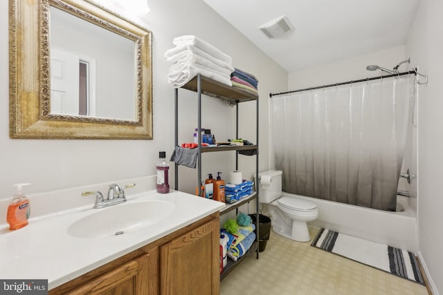 bathroom with visible vents, vanity, tile patterned floors, toilet, and shower / bath combo with shower curtain