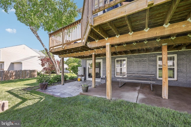 exterior space with fence and a deck