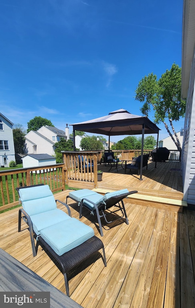 wooden deck with a gazebo