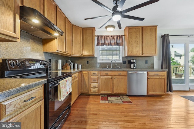 kitchen featuring a sink, ventilation hood, dishwasher, plenty of natural light, and black range with electric cooktop
