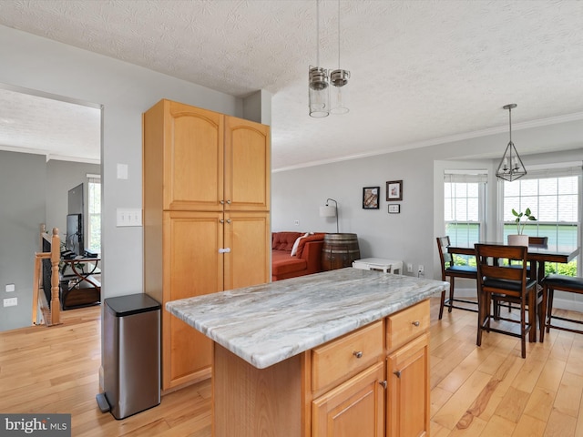 2311 Crosslanes Way, Odenton, MD 21113 - kitchen with a textured ceiling, light wood-type flooring, a notable chandelier, pendant lighting, and ornamental molding