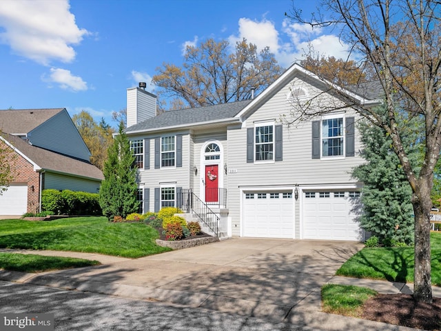 2311 Crosslanes Way, Odenton, MD 21113 - bi-level home featuring a chimney, a front lawn, concrete driveway, and a garage