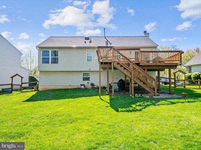 2311 Crosslanes Way, Odenton, MD 21113 - back of property with a lawn, stairs, fence, and a deck