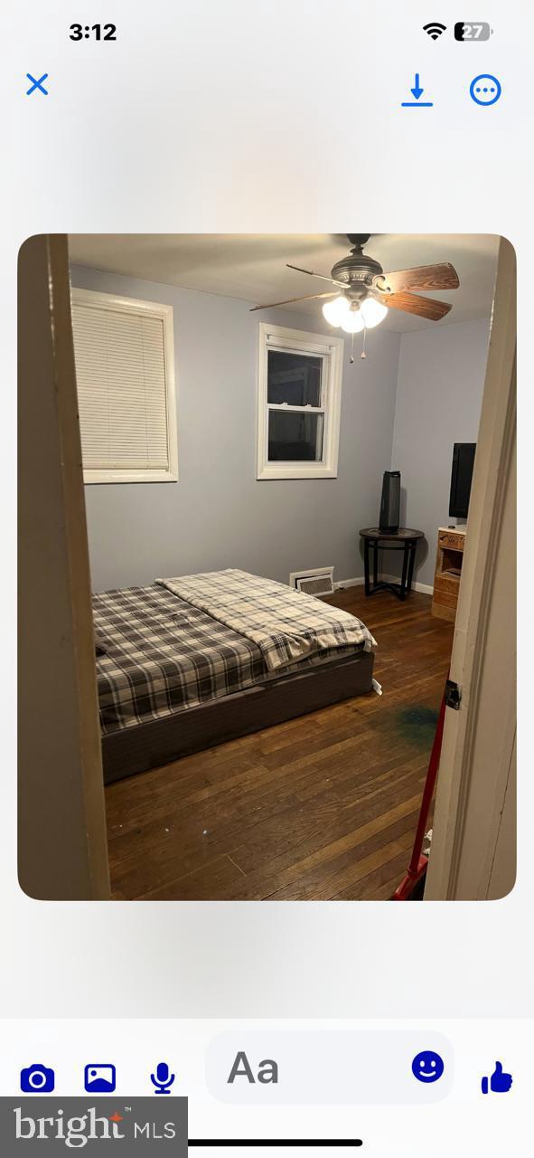 6020 67th Pl, Riverdale, MD 20737 - bedroom with dark wood finished floors and baseboards
